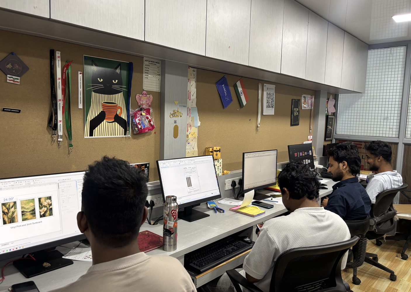 The AD Film Works Media creative team collaborating at workstations